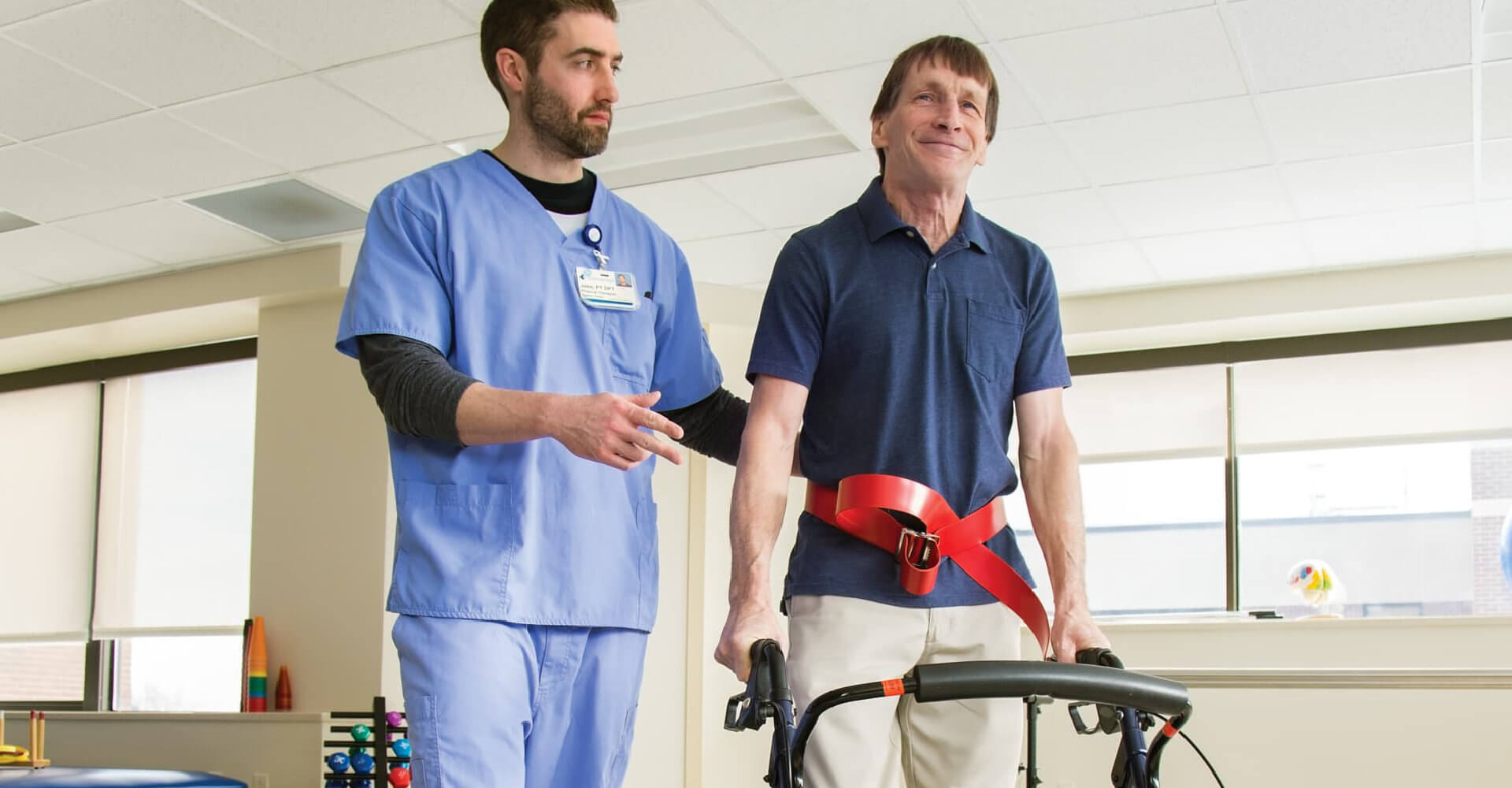 nurse assiting an injured patient walking