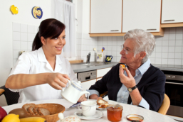 caregiver and elder in the kitchen