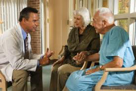 doctor talking to seniors