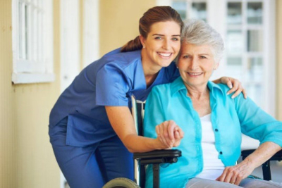 Nurse and senior woman smiling